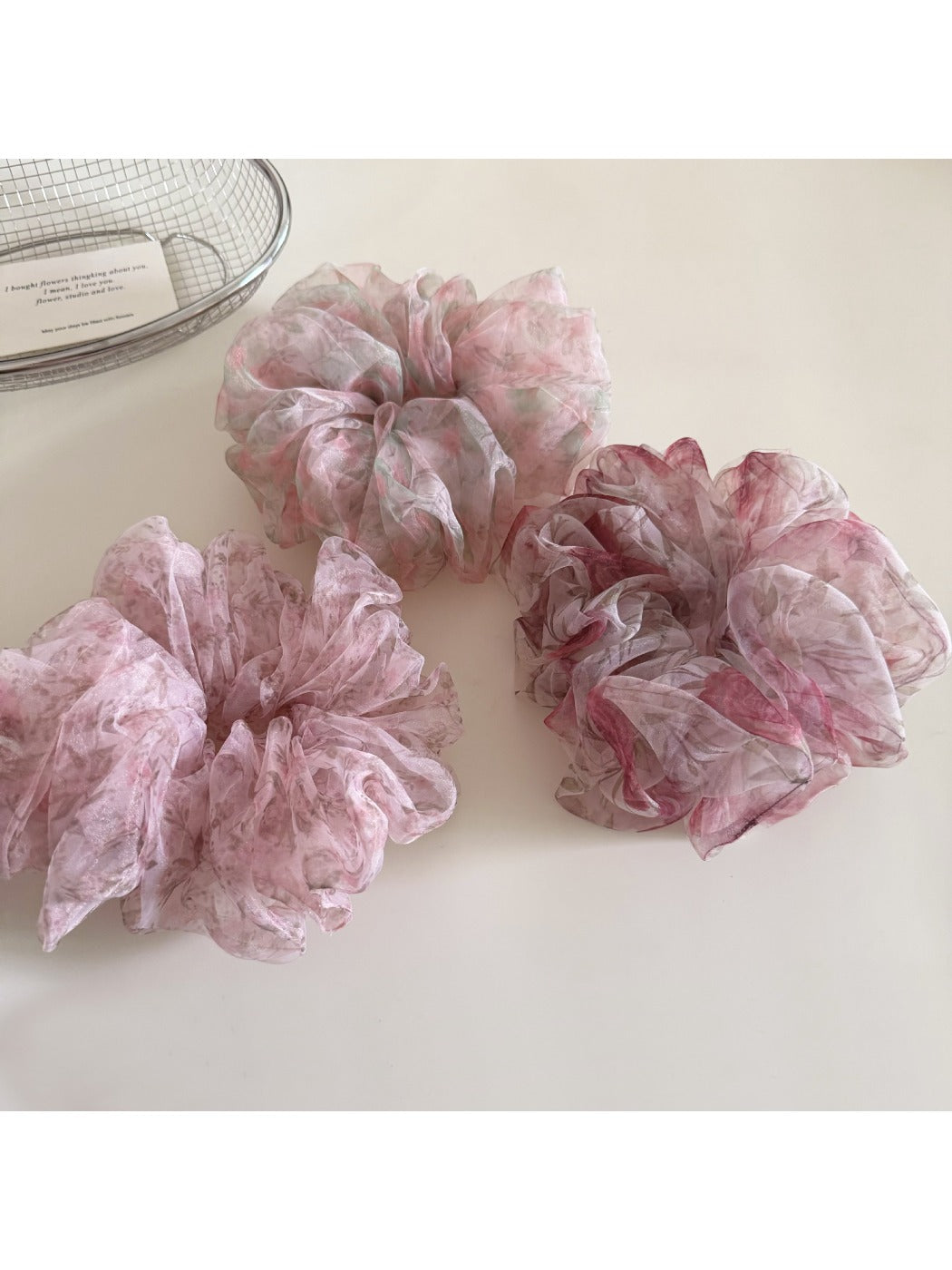 Top view of Gifty ditsy floral print hair scrunchie showing gathered fabric and elastic band