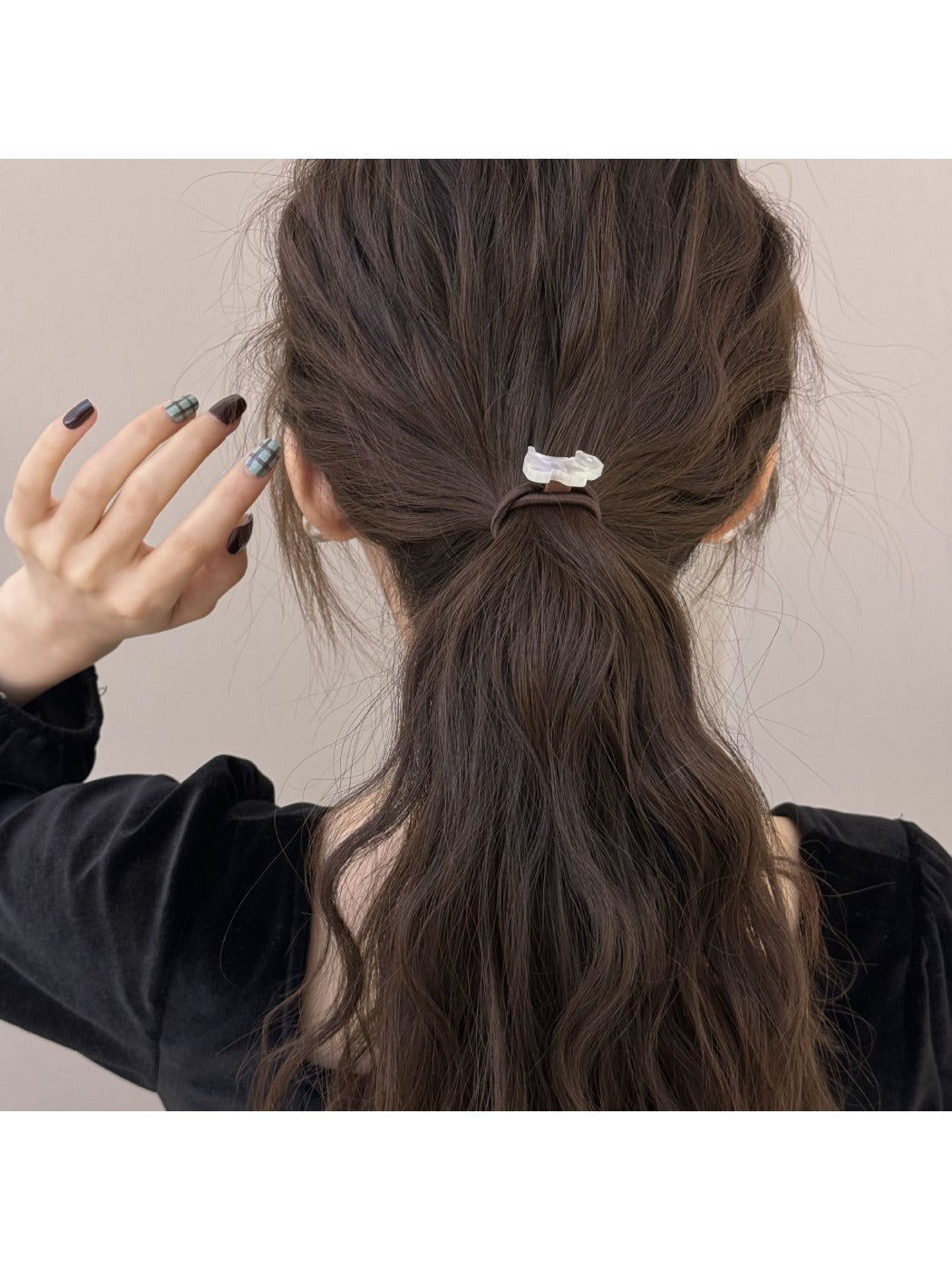 Side view of Gifty cartoon puppy hair tie showing detailed bead embellishments