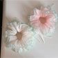 Gifty Ribbon Knot Tulle Scrunchie worn on a model's wrist with casual outfit