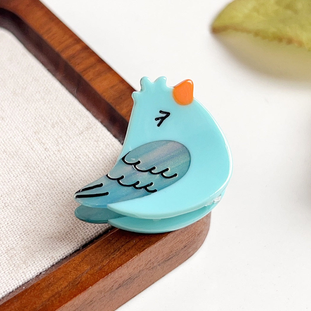 Teal bird hair claw clip