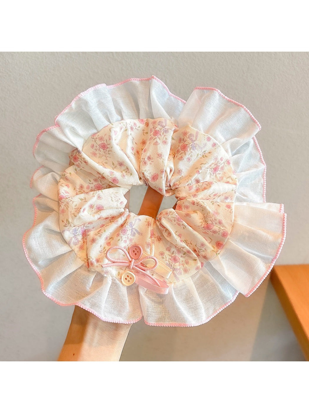 Top view of Gifty high stretch scrunchie displaying small colorful floral design