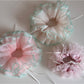 Gifty Ribbon Knot Tulle Scrunchie displayed on a wooden surface with natural light