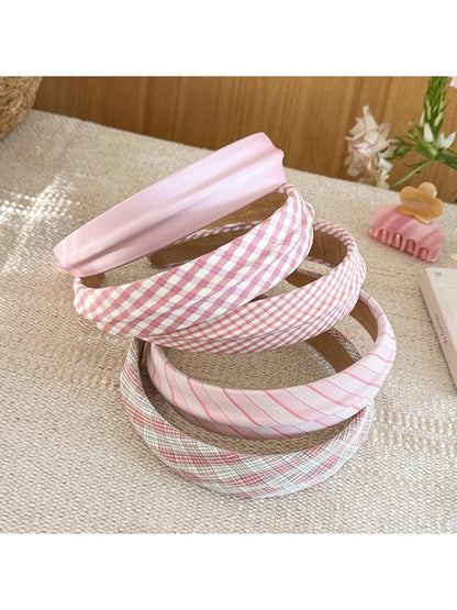 Close-up of Gifty headband showing beige and white plaid fabric texture
