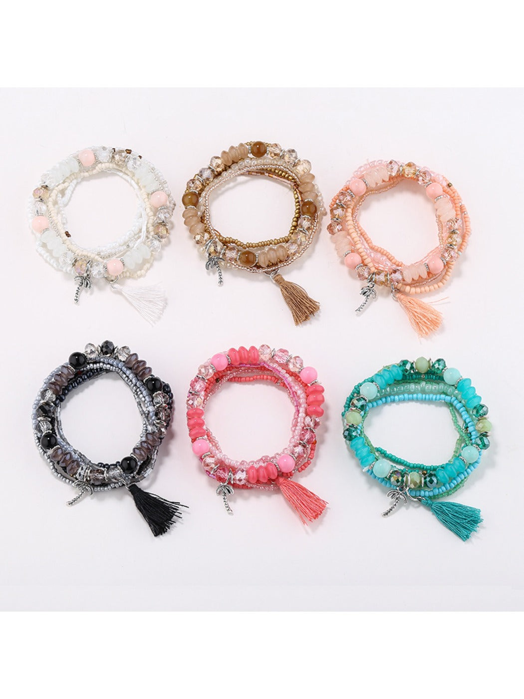 Lovra boho multi-row beaded bracelet with colorful tassels on a white background