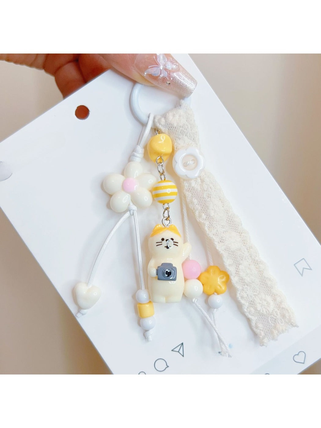 Close-up of the cat keychain's face showing detailed eyes and nose