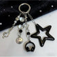 Minimalist star-shaped keychain with a smiley face design in gold tone