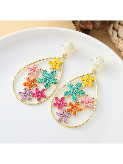 Close-up of the raffia flower design on Earedge statement drop earrings