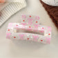 Beau hair claw clip displayed alongside matching hair accessories