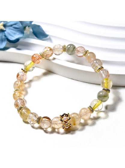 Lovra minimalist crystal beaded bracelet displayed on a wooden surface