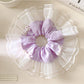 Gifty elegant plaid bow scrunchie in beige and brown tones on white background