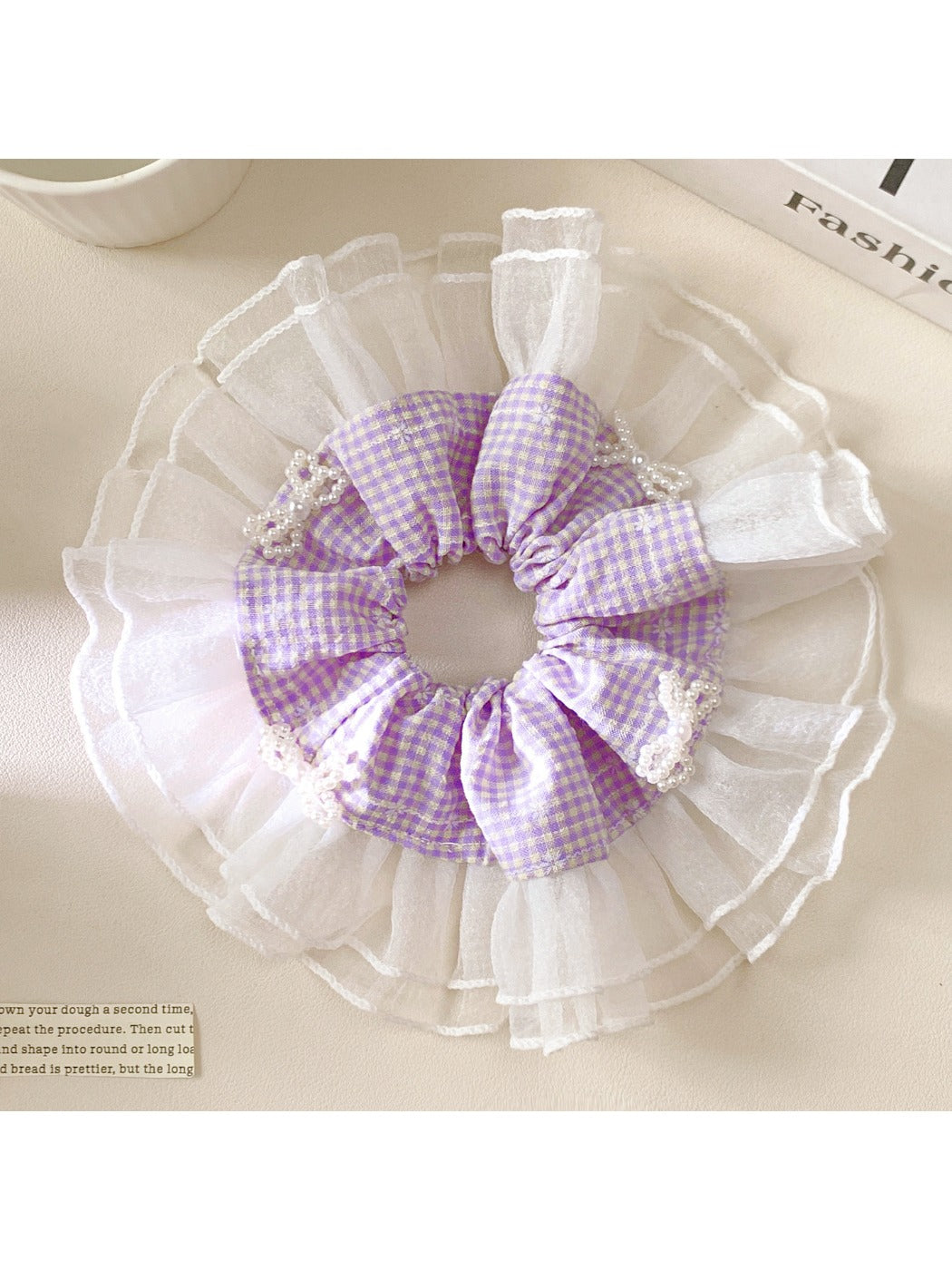 Gifty elegant plaid bow scrunchie in beige and brown tones on white background