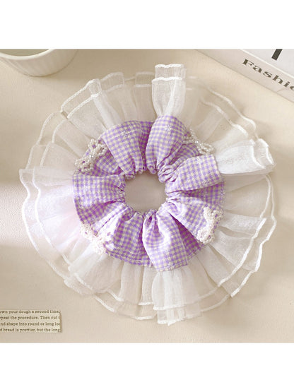 Gifty elegant plaid bow scrunchie in beige and brown tones on white background