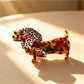 Beau cute cartoon dachshund claw clip resting on white surface