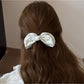 Close-up of Beau elegant bow banana clip showing bow detail and clasp mechanism