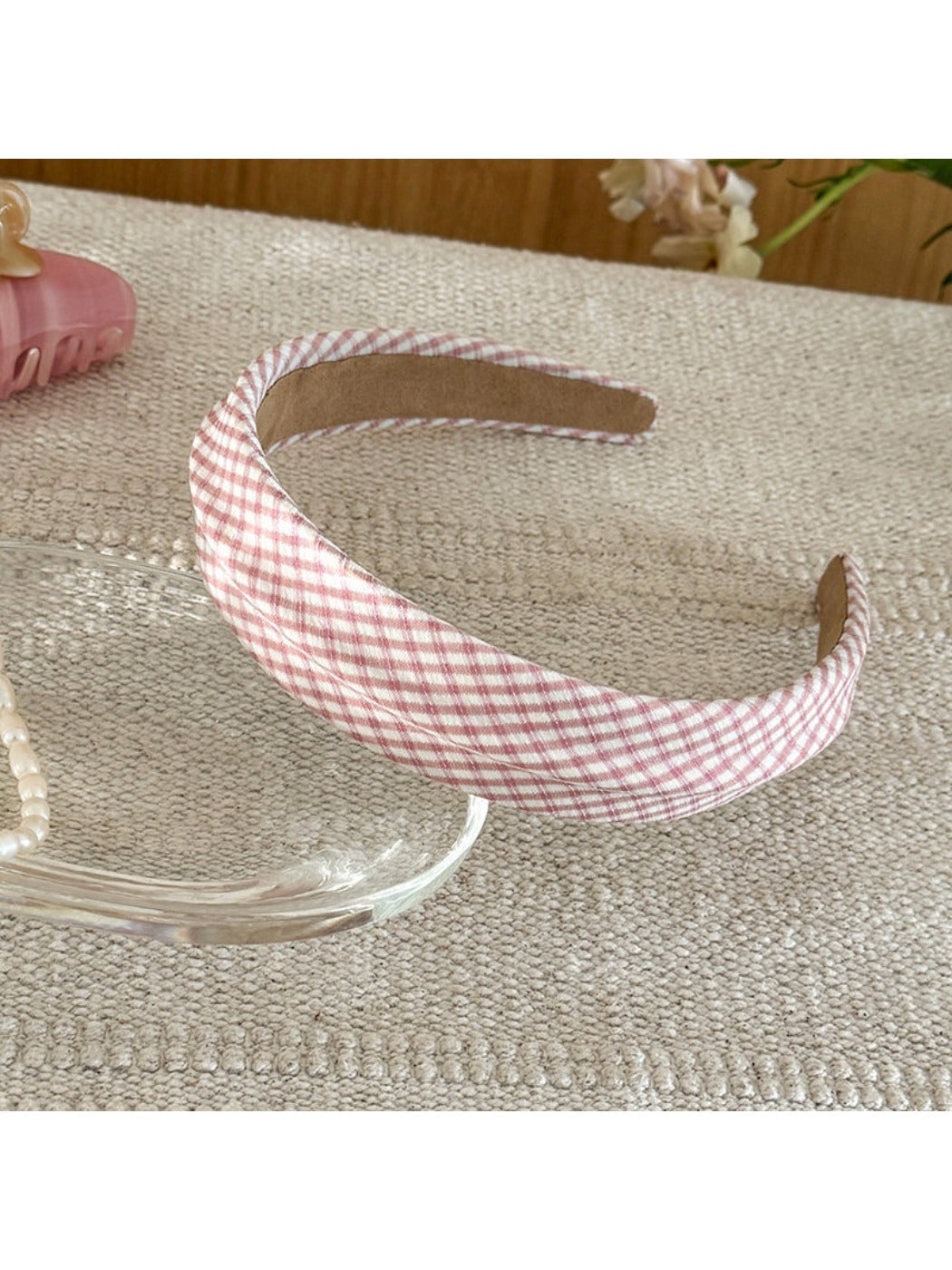 Gifty headband worn by model with hair down, showing plaid and stripe design