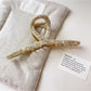 Beau vintage crisscross hair claw clip with intricate crisscross pattern detail