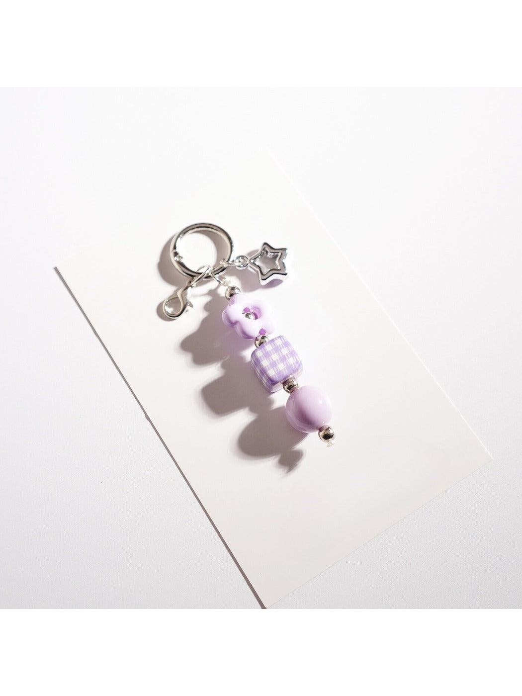 Multiple Keypus star keychains in different colors arranged in a row