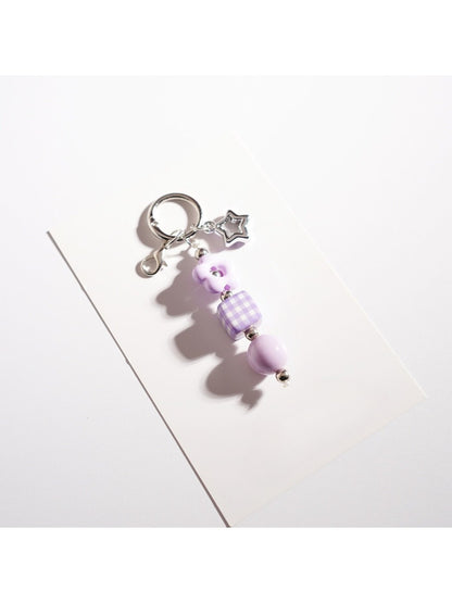 Multiple Keypus star keychains in different colors arranged in a row