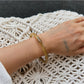 Lovra vintage ombre bangle bracelet displayed with matching accessories