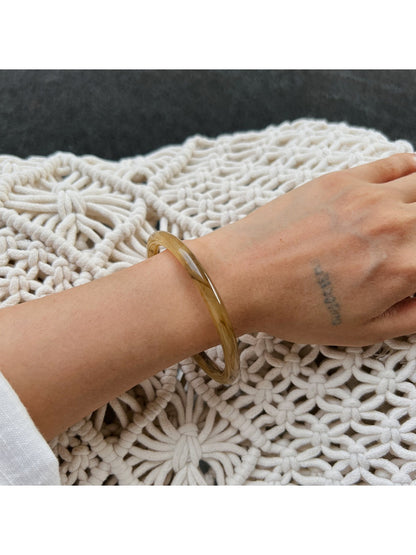 Lovra vintage ombre bangle bracelet displayed with matching accessories