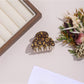 Top view of Beau leopard print hair clip highlighting fabric texture and clasp