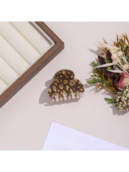 Top view of Beau leopard print hair clip highlighting fabric texture and clasp
