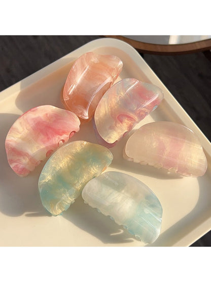 Close-up of Beau semi circular hair claw clip showing vibrant colors