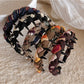 Side view of Gifty knitted fabric wrapped headband showing texture and stitching