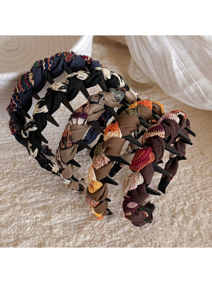 Side view of Gifty knitted fabric wrapped headband showing texture and stitching