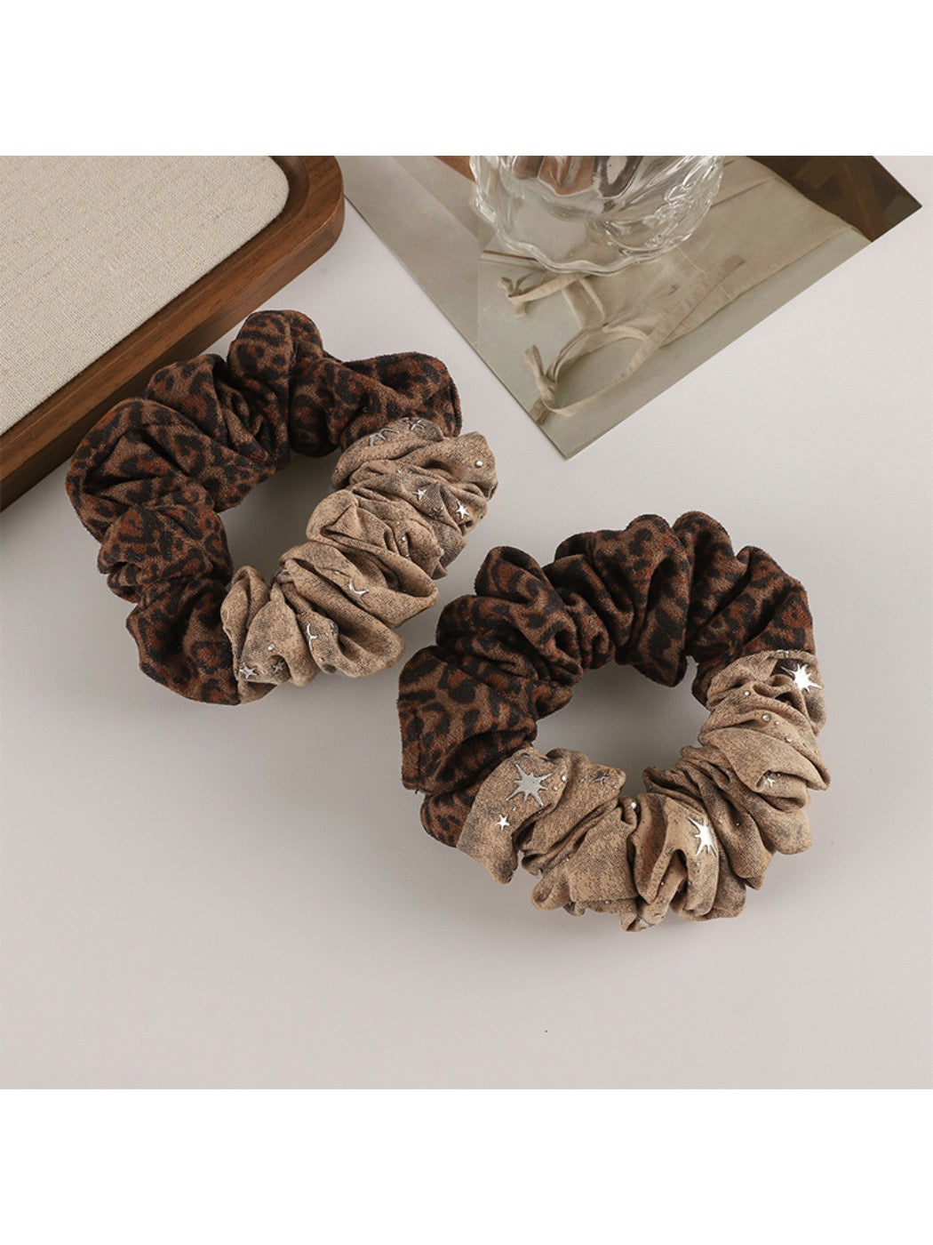 Gifty scrunchie styled on a wrist as a fashion accessory with retro vibe