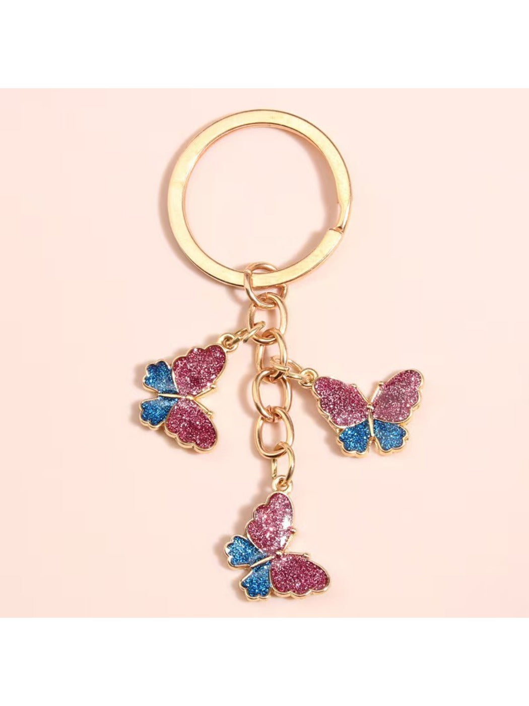 Side view of color block butterfly keychain highlighting its thickness and metal ring