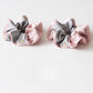 Close-up of Gifty scrunchie showing smooth fabric and color block pattern
