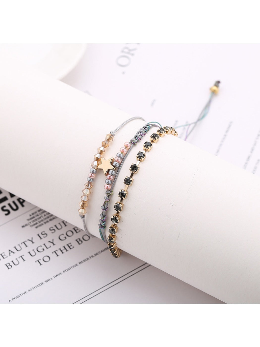 Lovra Five Point Star Bead Woven Bracelet with blue, white, and silver beads