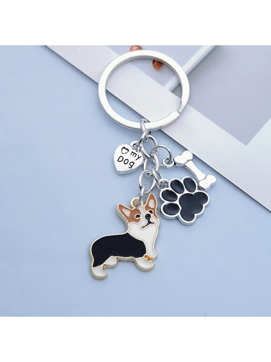 Puppy paw keychain attached to a backpack zipper pull
