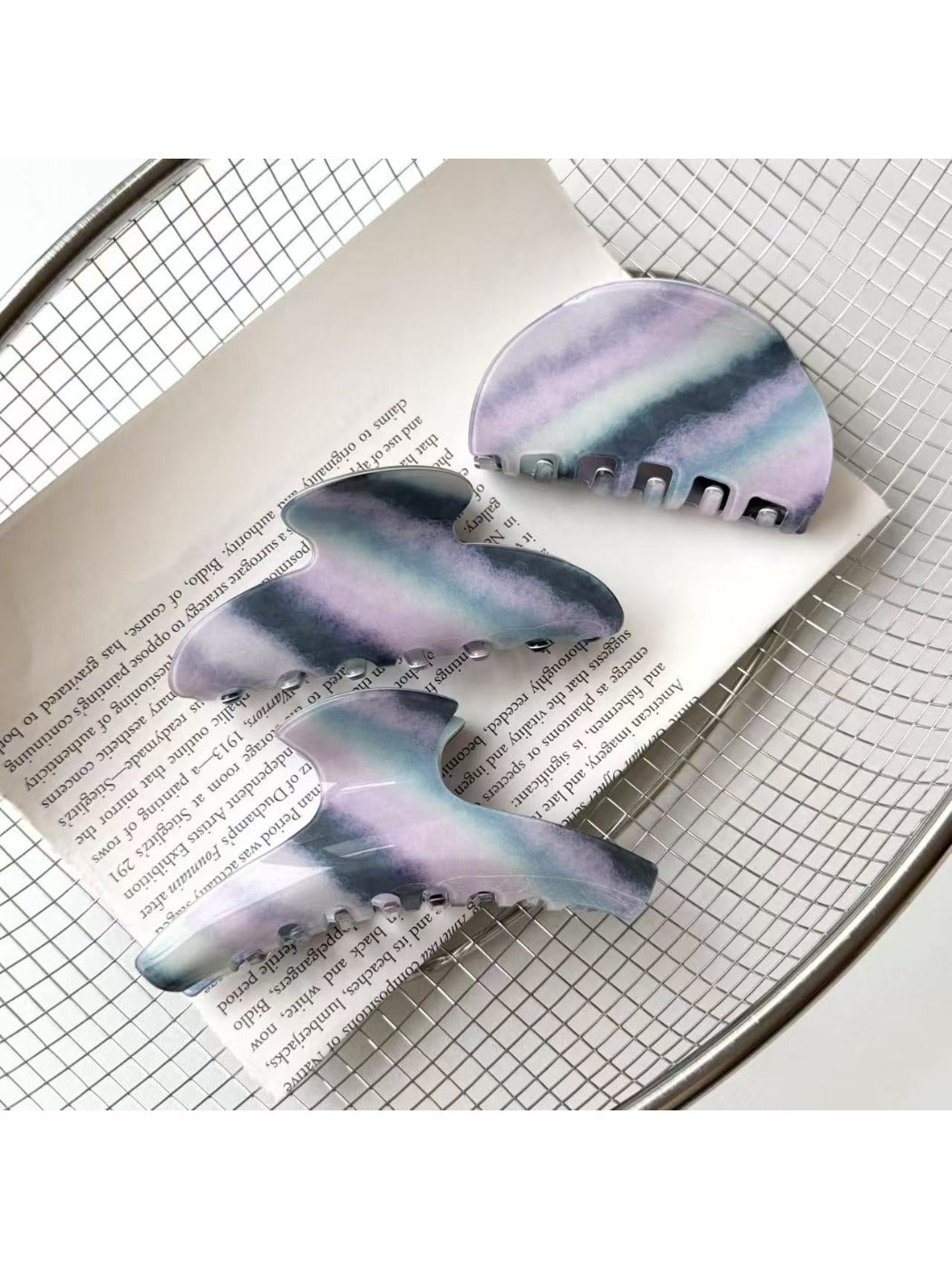 Close-up of Beau purple hair claw clip showing curved teeth design