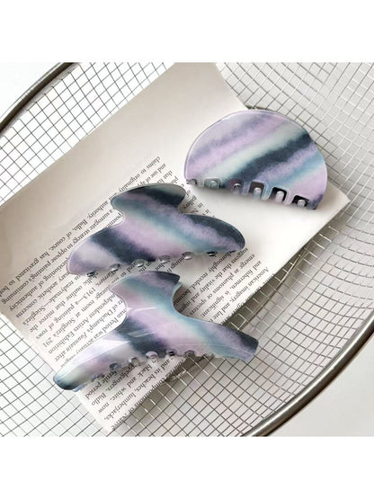 Close-up of Beau purple hair claw clip showing curved teeth design