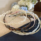 Gifty acetate chain style headband in tortoiseshell pattern on white background