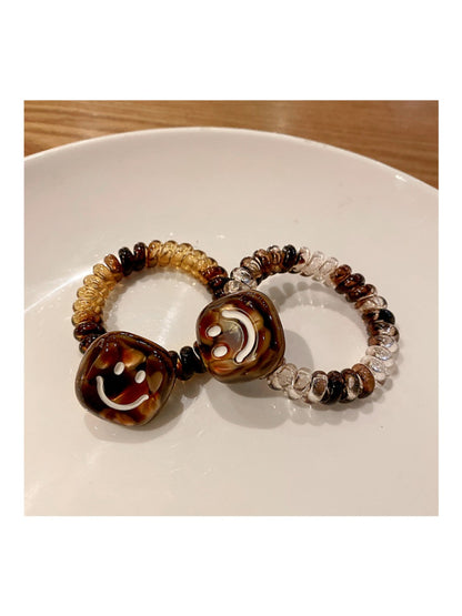 Gifty - Retro Spiral Cord Smiley Face Hair Tie