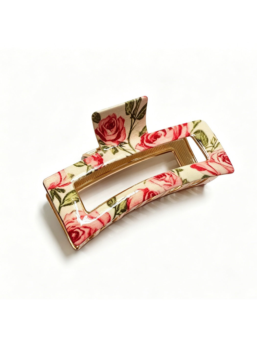 Beau rectangular hair clip placed on a white surface with visible flower details