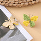 Side view of silver butterfly shaped drop earrings showing clasp detail