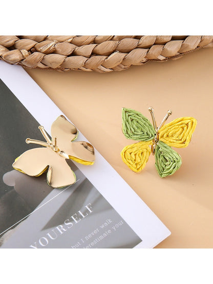 Side view of silver butterfly shaped drop earrings showing clasp detail