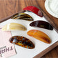 Close-up of Beau oval ponytail hair clip showing smooth acetate finish and clasp mechanism