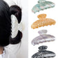Close-up of pearlescent finish on Beau claw clip highlighting smooth texture