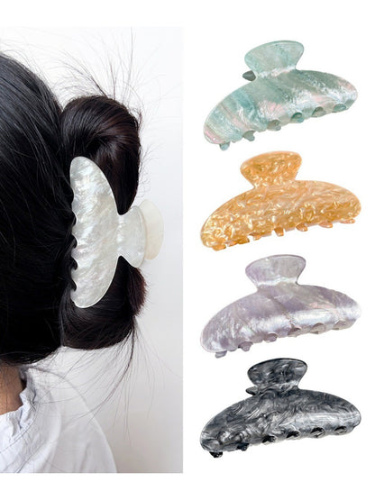 Close-up of pearlescent finish on Beau claw clip highlighting smooth texture