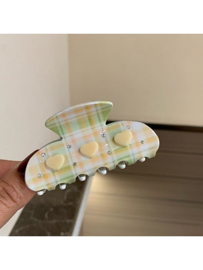 Beau Fresh Plaid Acetate Hair Clip held in hand to show size and scale