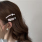 Beau chic flat hair clip held in hand to show size and shape