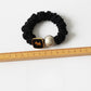 Gifty round bead hair tie worn on wrist as a bracelet