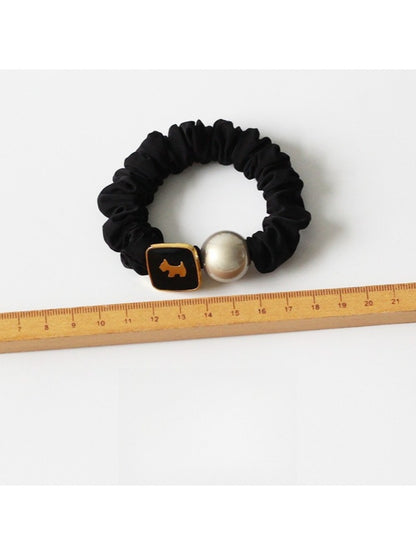 Gifty round bead hair tie worn on wrist as a bracelet