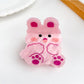 Beau cute animal hair claw clip in beige displayed on a wooden surface