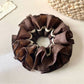 Side view of Gifty vintage dark double layered scrunchie showing fabric texture